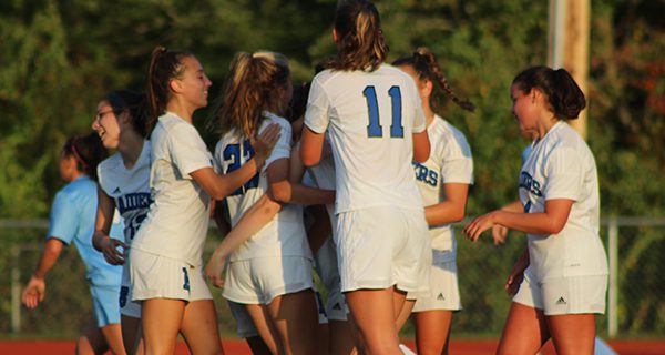 The DS girls celebrate following Cerys Balmer’s go-ahead goal midway through the second half of Tuesday’s 3-2 victory at Medfield.
