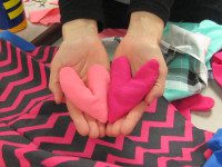 Library crafters stitch hand-warmers