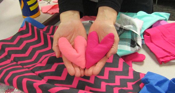 Library crafters stitch hand-warmers