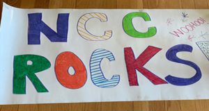 NCC Rocks! Woohoo! Hand-drawn banner.