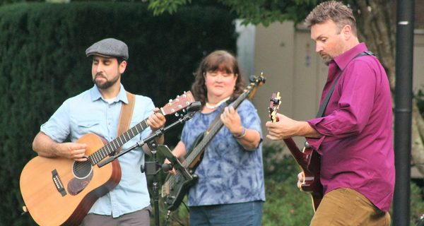 Kids play, adults listen at concert