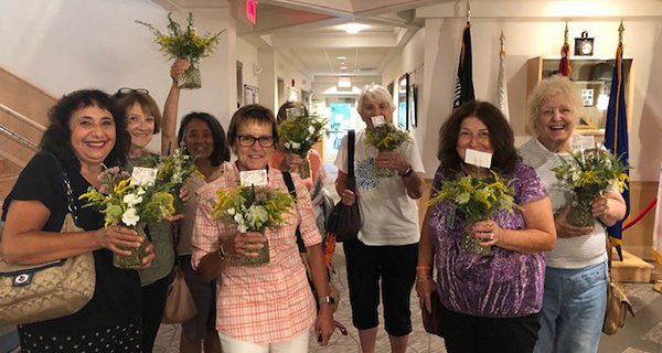 Seniors arrange flowers at COA