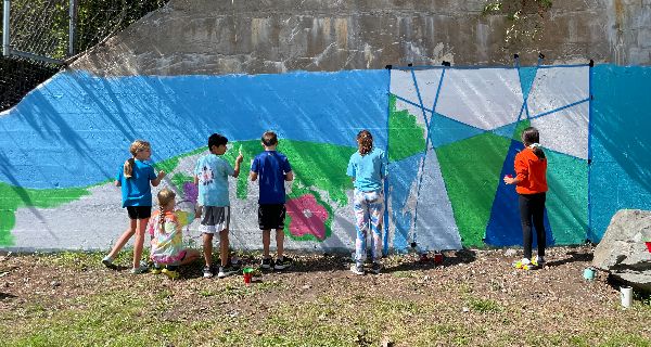 Needhamites paint community mural