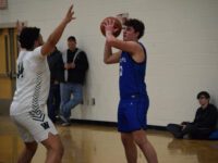Boys’ Basketball bit by the Wolverines