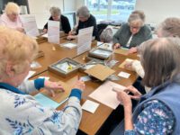 Seniors craft Pebble Art