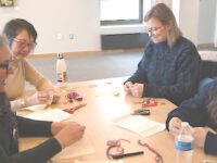 Stitchers of all levels learn in embroidery class at Sherborn Library