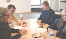 Stitchers of all levels learn in embroidery class at Sherborn Library