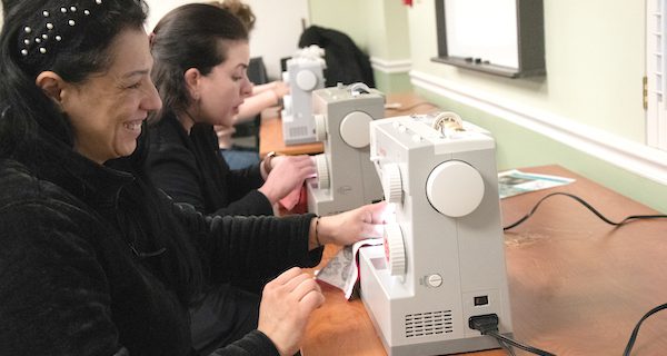 Residents Practice Sewing, Craft Neck Warmers at MPL