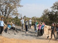 NHS students travel to help spread power of education