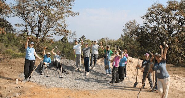 NHS students travel to help spread power of education