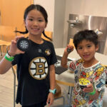 Bruins players help kick-off summer reading